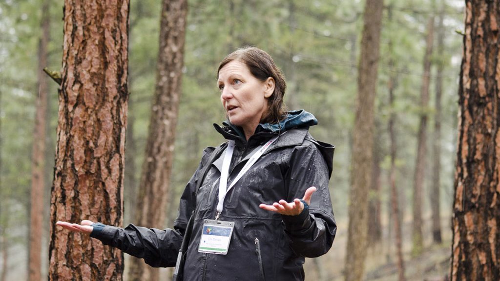 woman speaking in forest